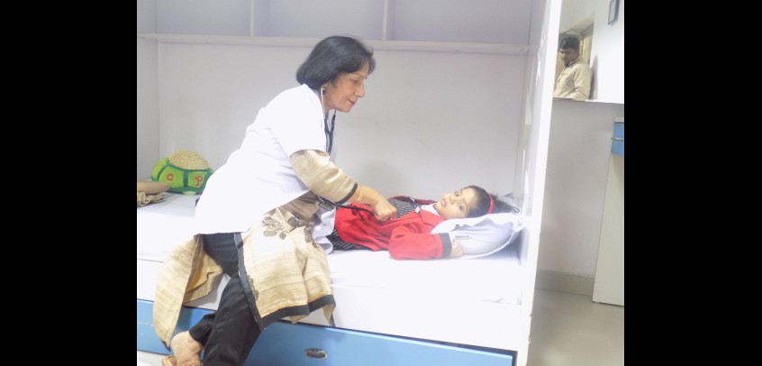 the image shows a doctor is checking up a primary wing student,best school for primary class
