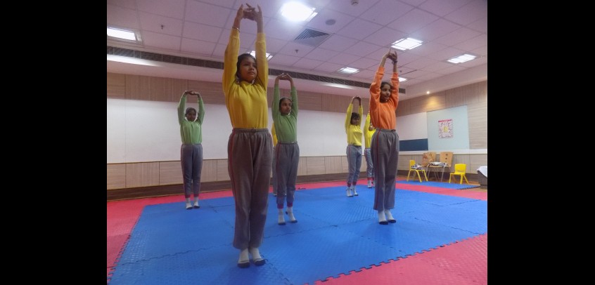 yoga room in school,image shows students are doing yoga
