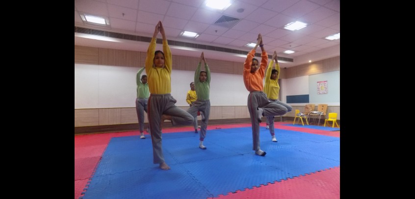 yoga room in school,image shows students are doing yoga
