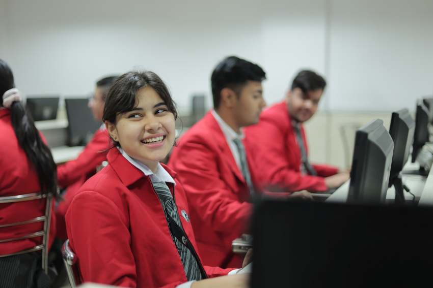 the image shows students are doing practical work in computer lab, best cbse school in delhi
