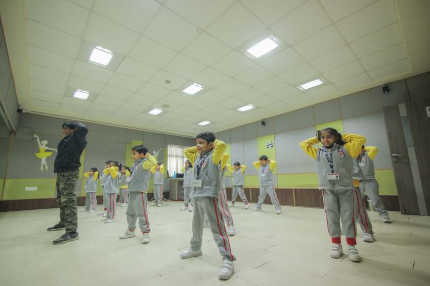 the image shows students performing extra curricular activity, best school in extra curricular activities
